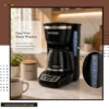 Home coffee station featuring a programmable drip coffee maker with glass carafe
