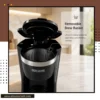 Modern kitchen setup with a programmable coffee maker and freshly brewed coffee