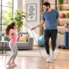 Adult and child using jump ropes together for a home exercise and fitness workout